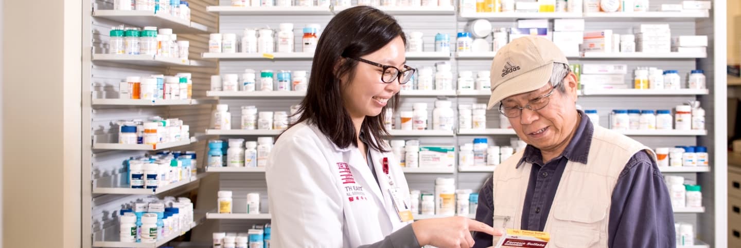 Pharmacist helping patient