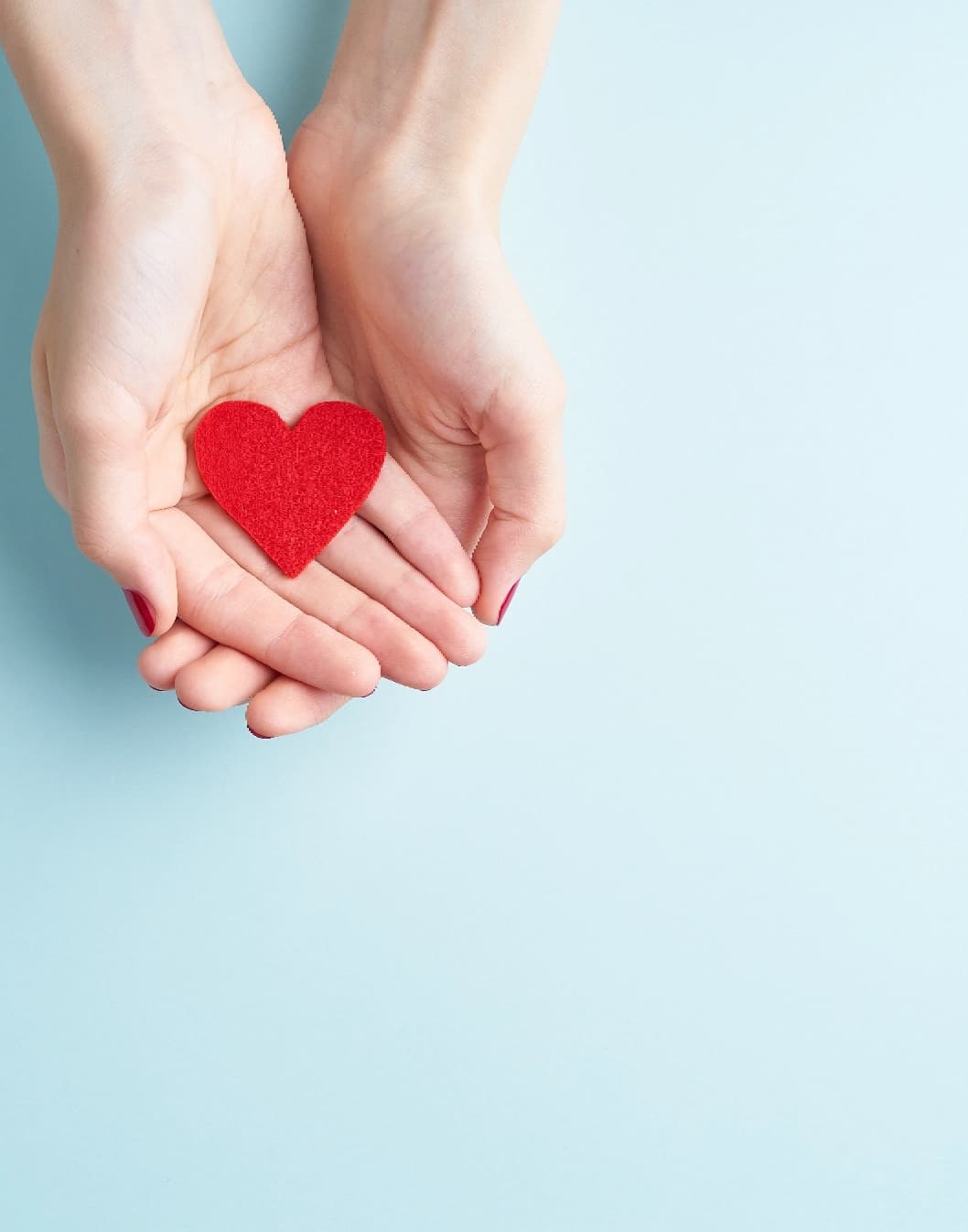 Hands holding a heart